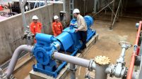 Workers looking at Industrial Pump