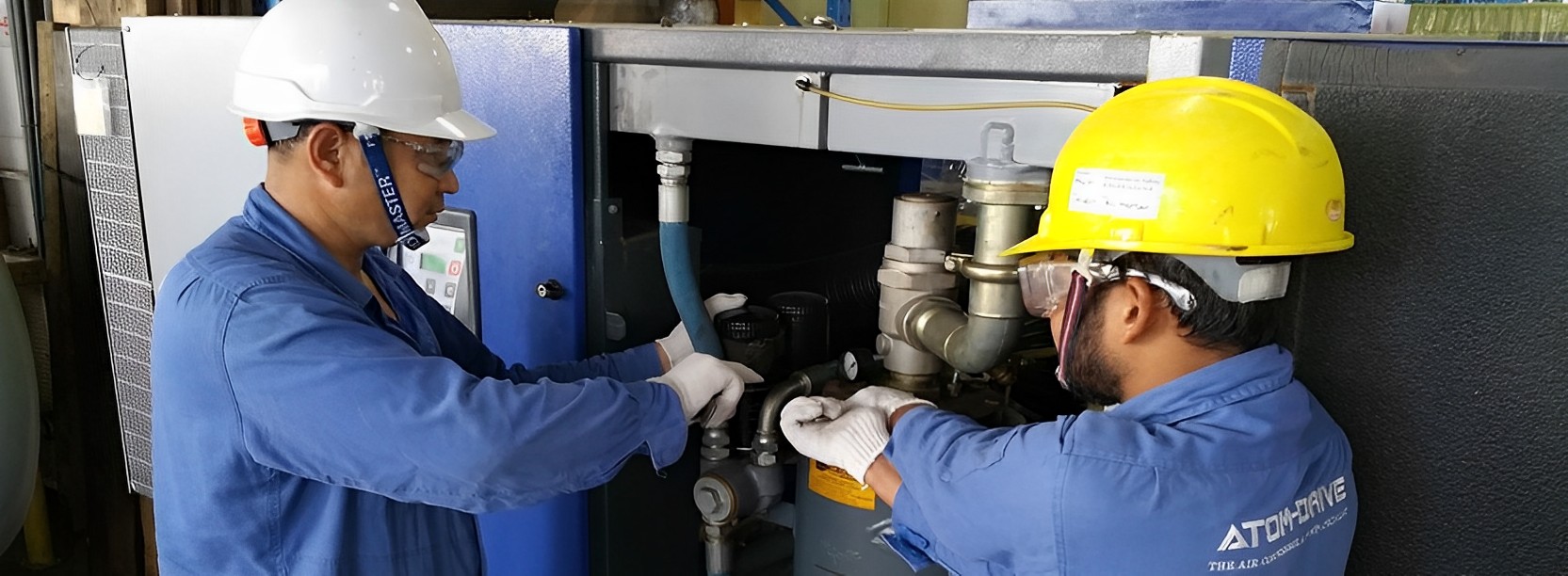 Atom-Drive Technicians performing air compressor servicing